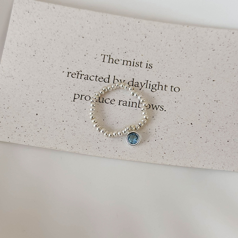 Синій еластичний перстень з кришталевими намистинами