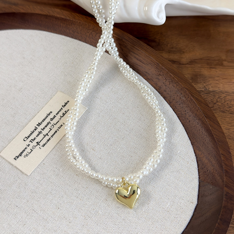 Подвійний намисто-чокер з перлами у вигляді скрученого серця