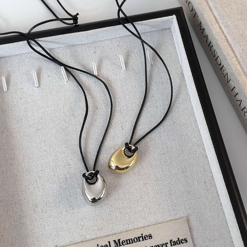 Геометричний кулон-біб