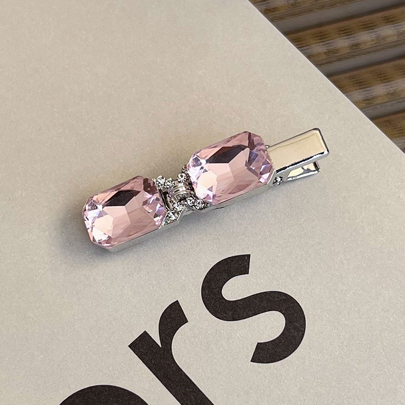 Боковая заколка с розовым стразами в виде сердца