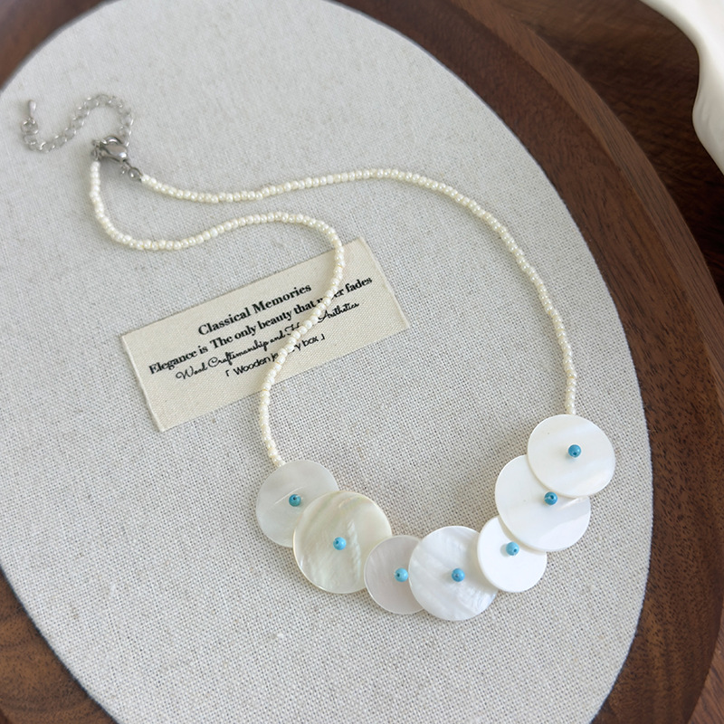 Намисто з круглими ракушками та дисковою підвіскою