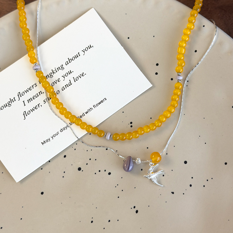 قلادة خرز زجاجي أصفر مكدس