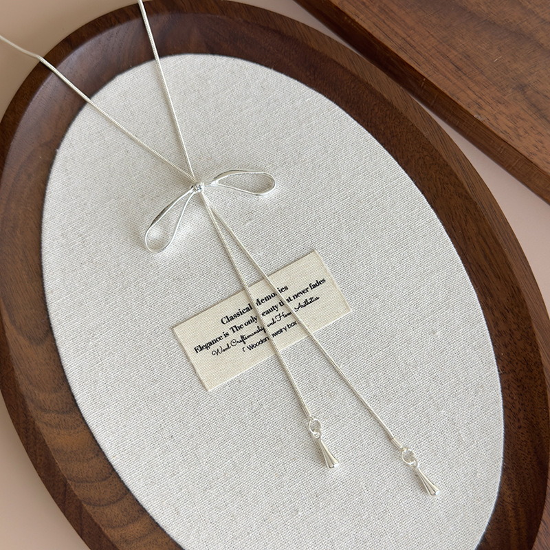 Срібне регульоване намисто з бантом