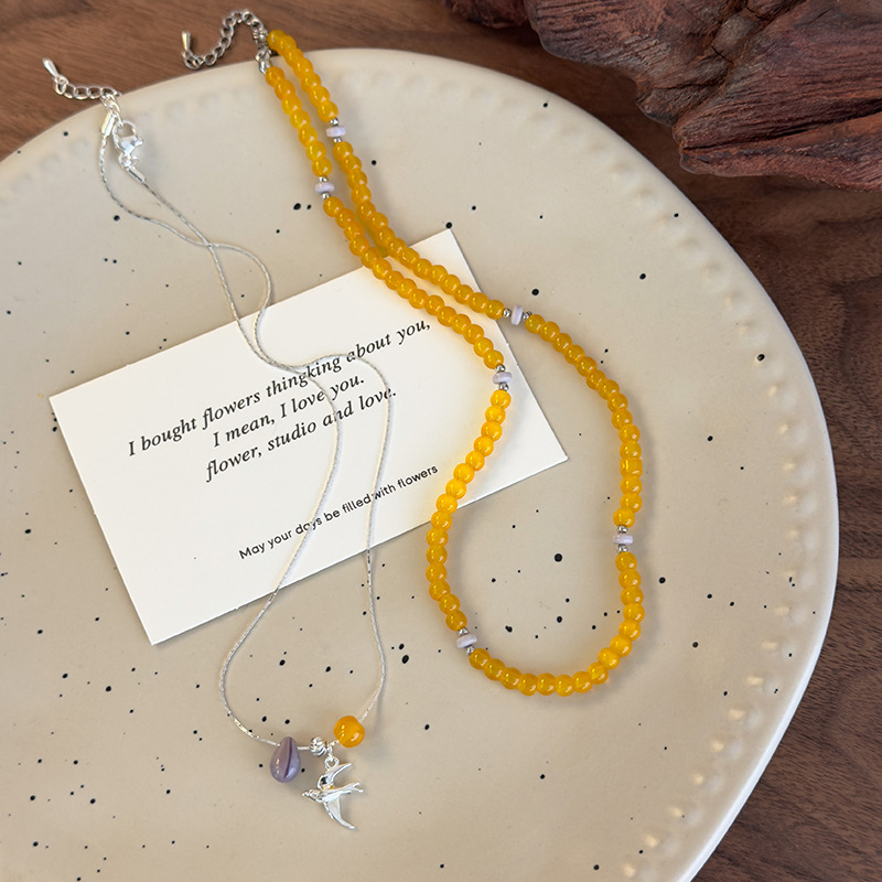 قلادة خرز زجاجي أصفر مكدس