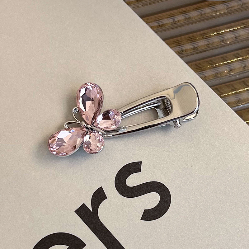 Боковая заколка с розовым стразами в виде сердца