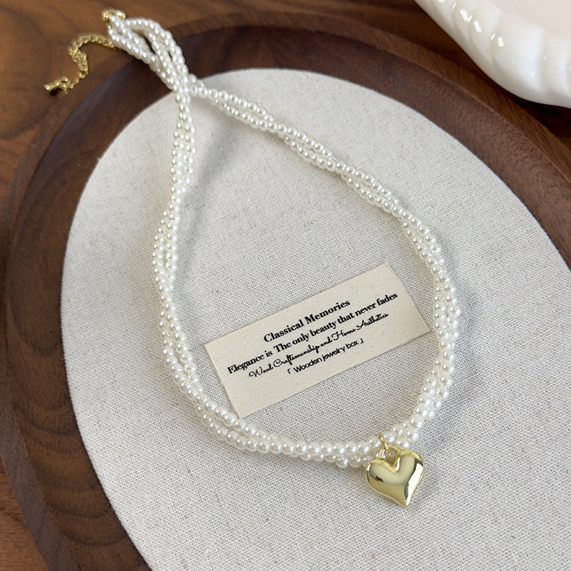 Подвійний намисто-чокер з перлами у вигляді скрученого серця