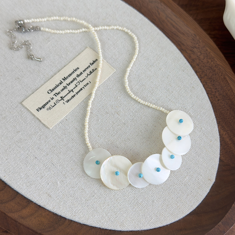 Намисто з круглими ракушками та дисковою підвіскою