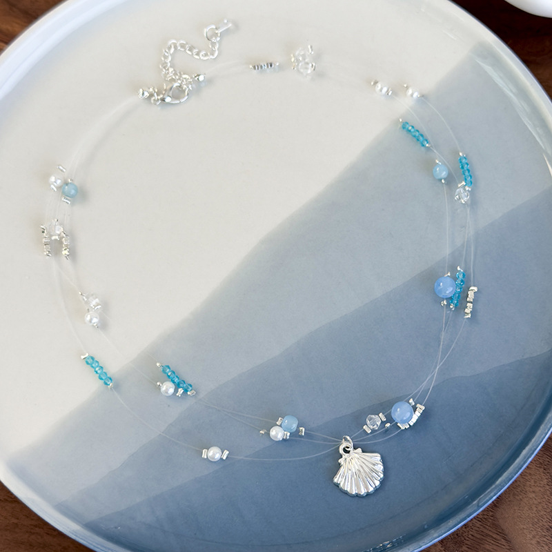 Намисто з блакитними кришталевими намистинами в морській тематиці