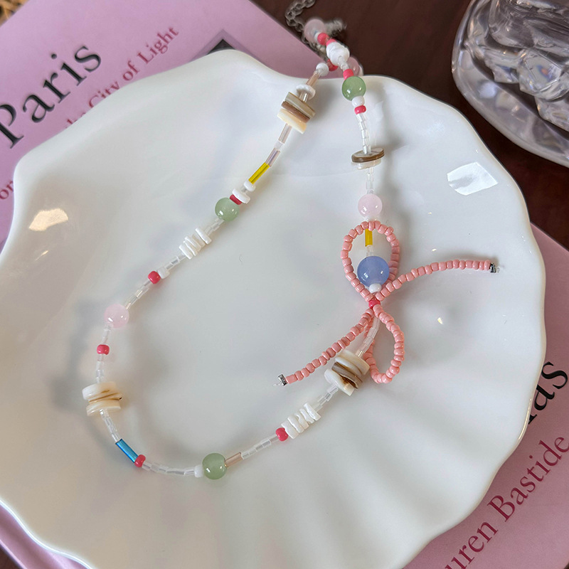 สร้อยคอแพนด้นต์โบว์และเปลือกหอย