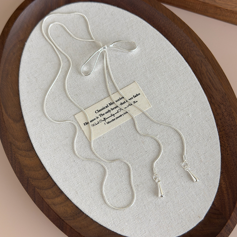 Срібне регульоване намисто з бантом