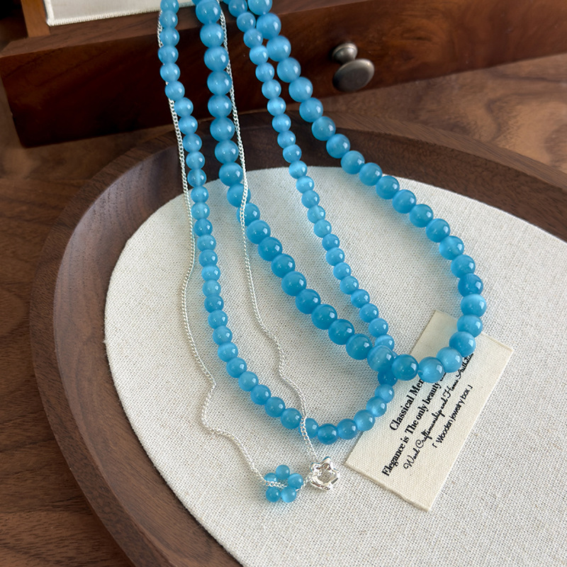 Багатошарове намисто з блакитною котячим оком квітки