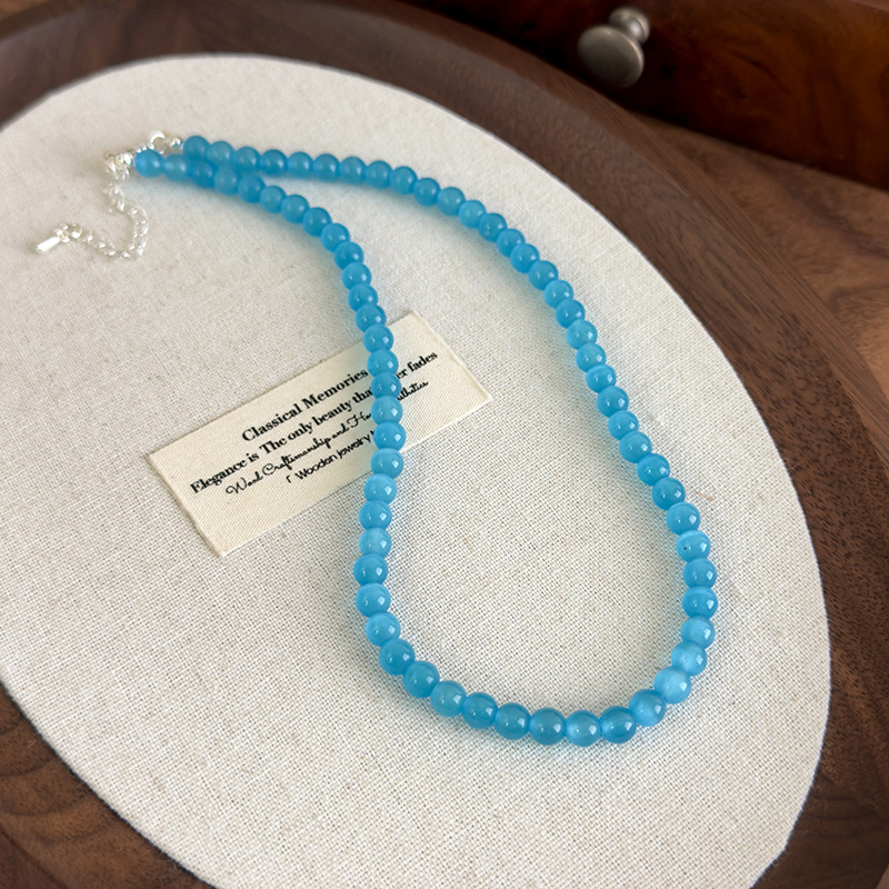 Багатошарове намисто з блакитною котячим оком квітки