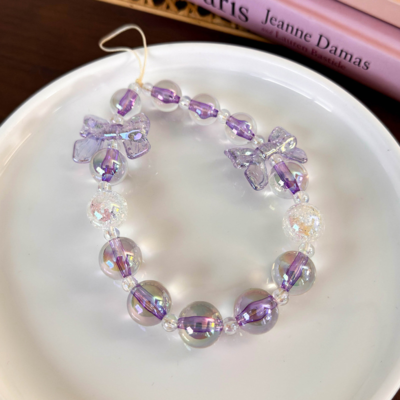 سلسلة هاتف مطرزة بشرائط