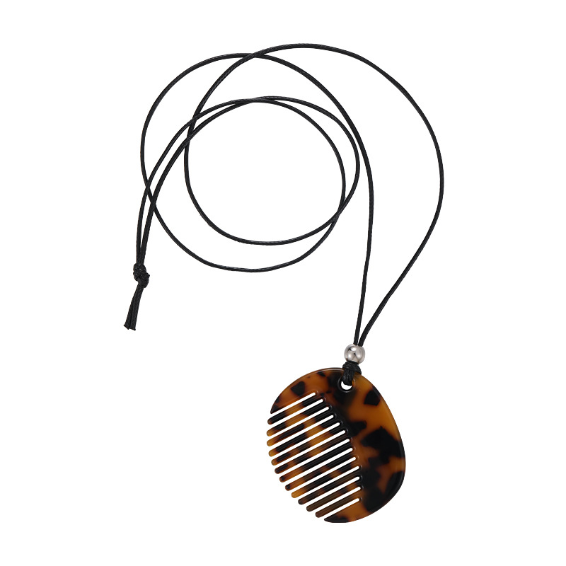 Намисто з кулоном-гребінцем