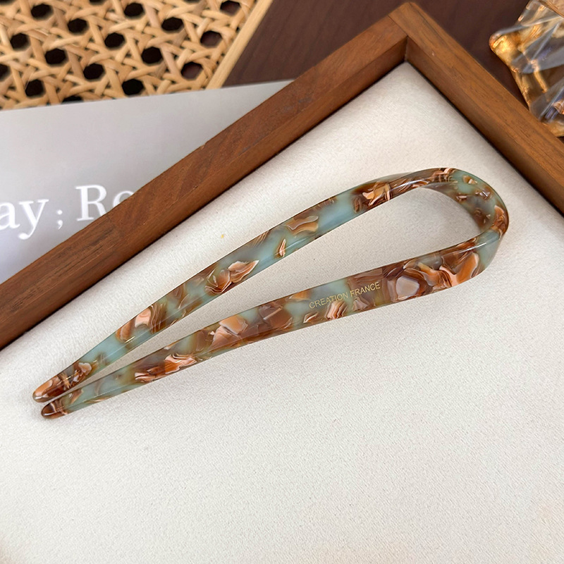 دبوس شعر على شكل U من الأسيتات