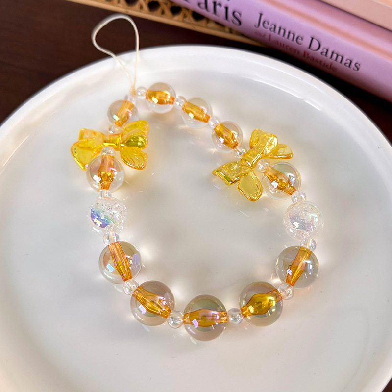 سلسلة هاتف مطرزة بشرائط