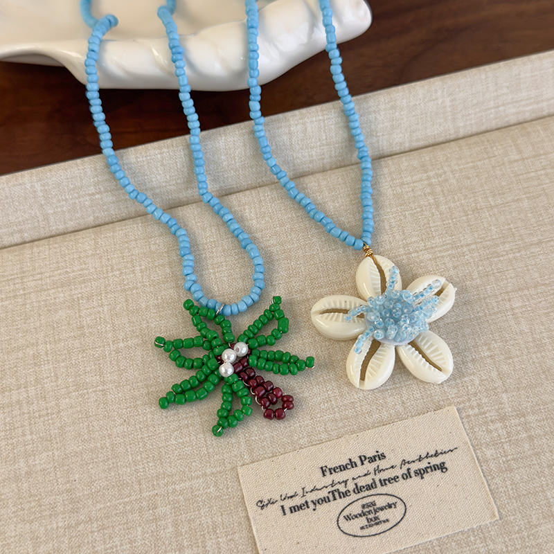 Блакитне намисто з пальмою та намистинами