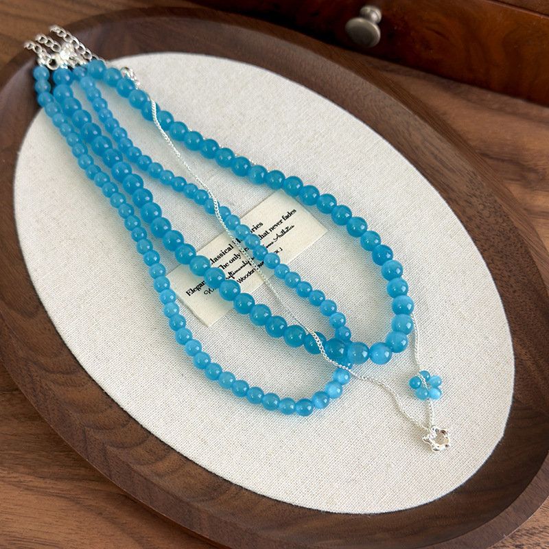 Багатошарове намисто з блакитною котячим оком квітки