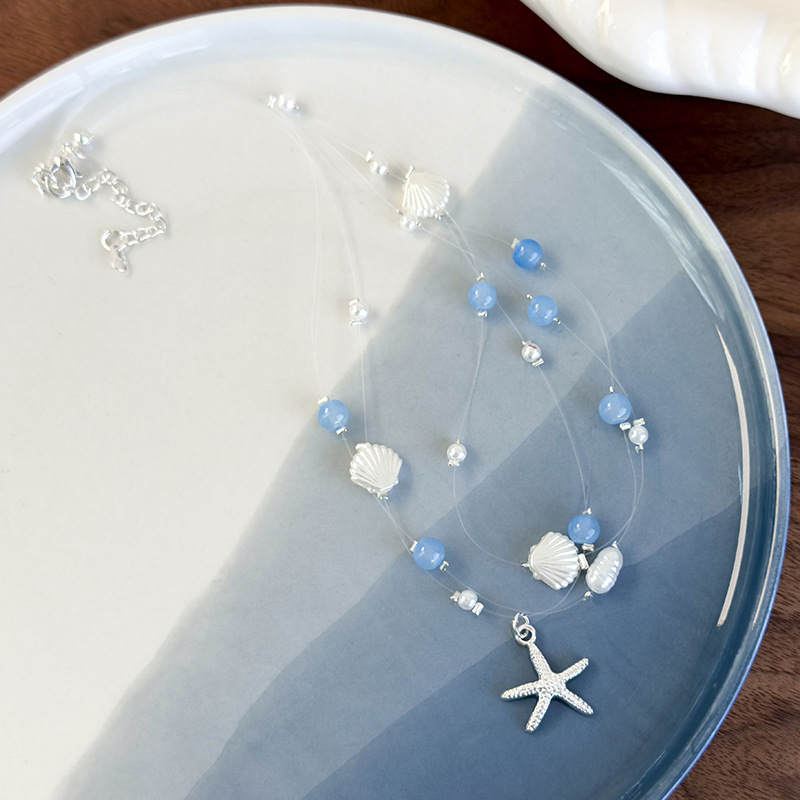 Намисто з блакитними кришталевими намистинами в морській тематиці