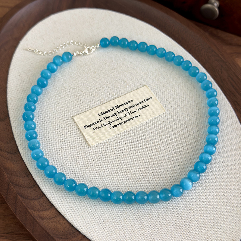 Багатошарове намисто з блакитною котячим оком квітки