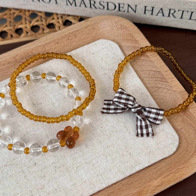 Σύνολο Ρυθμιζόμενων Βραχιόλιων με Χάντρες και Φιόγκο