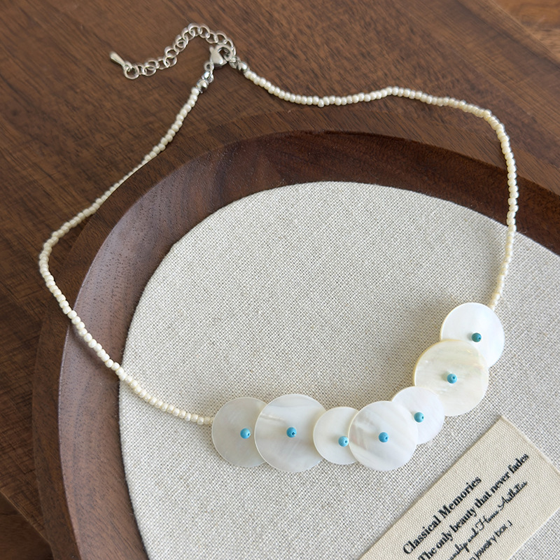 Намисто з круглими ракушками та дисковою підвіскою