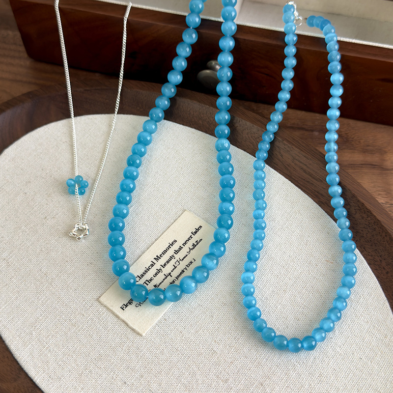 Багатошарове намисто з блакитною котячим оком квітки