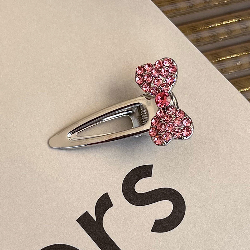 Боковая заколка с розовым стразами в виде сердца