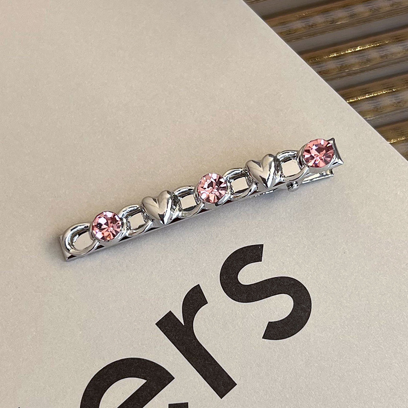 Боковая заколка с розовым стразами в виде сердца