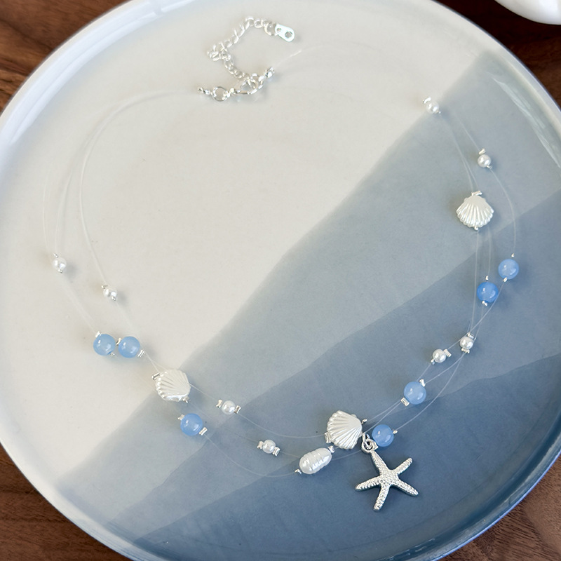 Намисто з блакитними кришталевими намистинами в морській тематиці