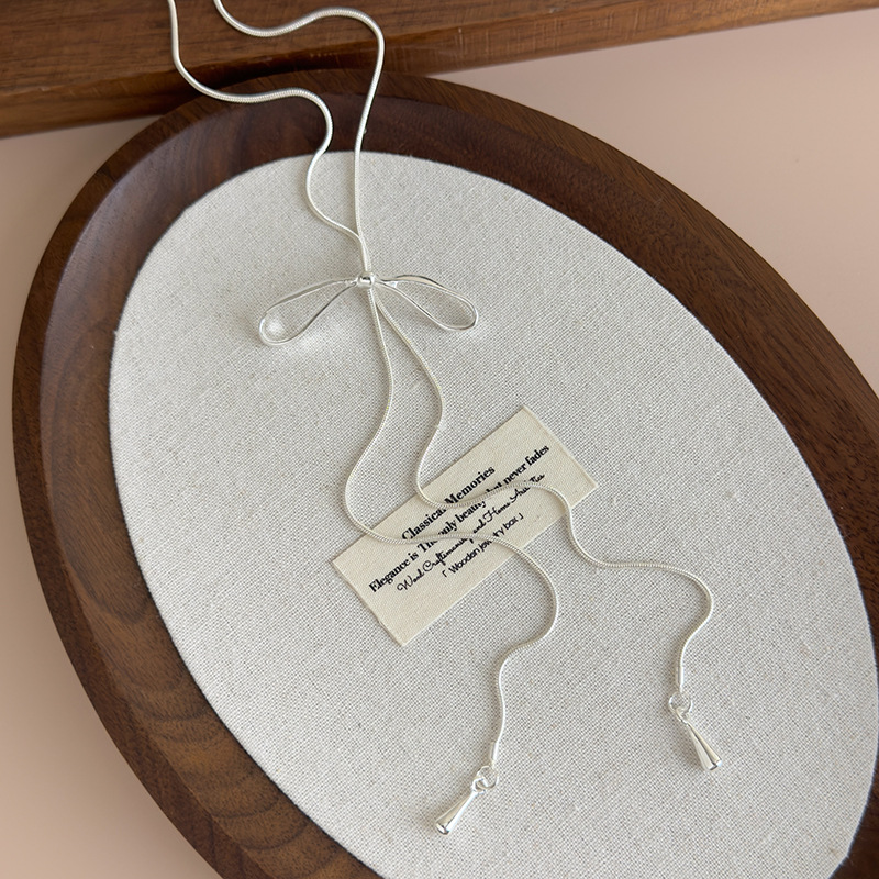 Срібне регульоване намисто з бантом