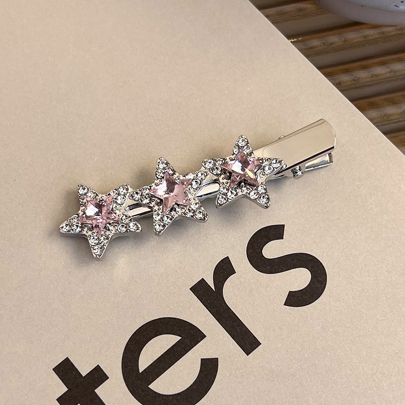 Боковая заколка с розовым стразами в виде сердца