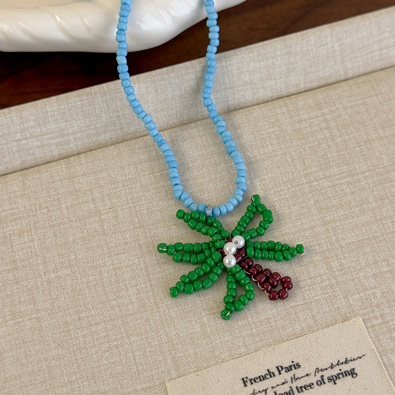 Блакитне намисто з пальмою та намистинами