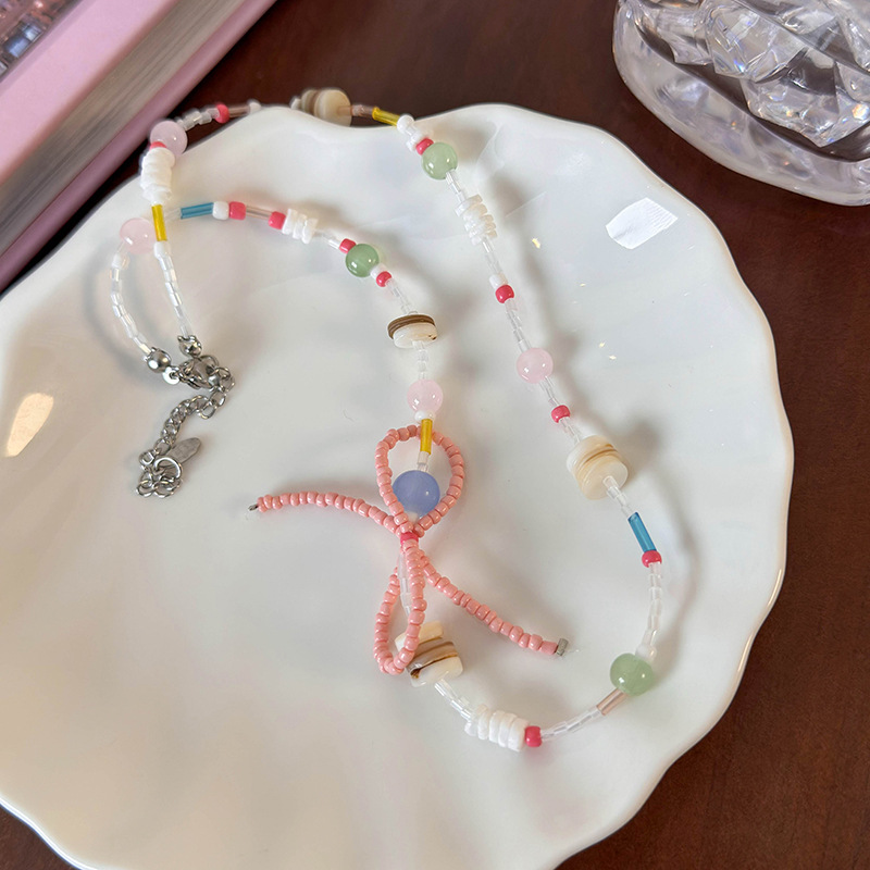 สร้อยคอแพนด้นต์โบว์และเปลือกหอย