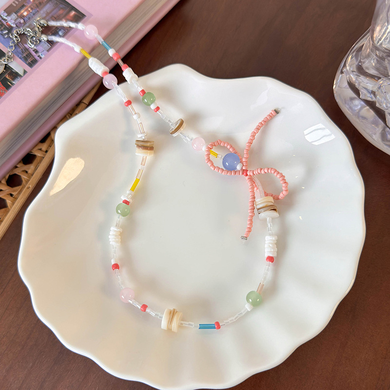 สร้อยคอแพนด้นต์โบว์และเปลือกหอย