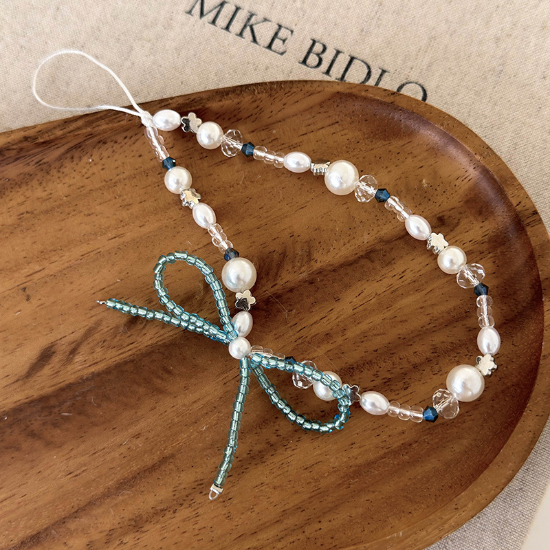 Браслет для телефона з бісером та бантом