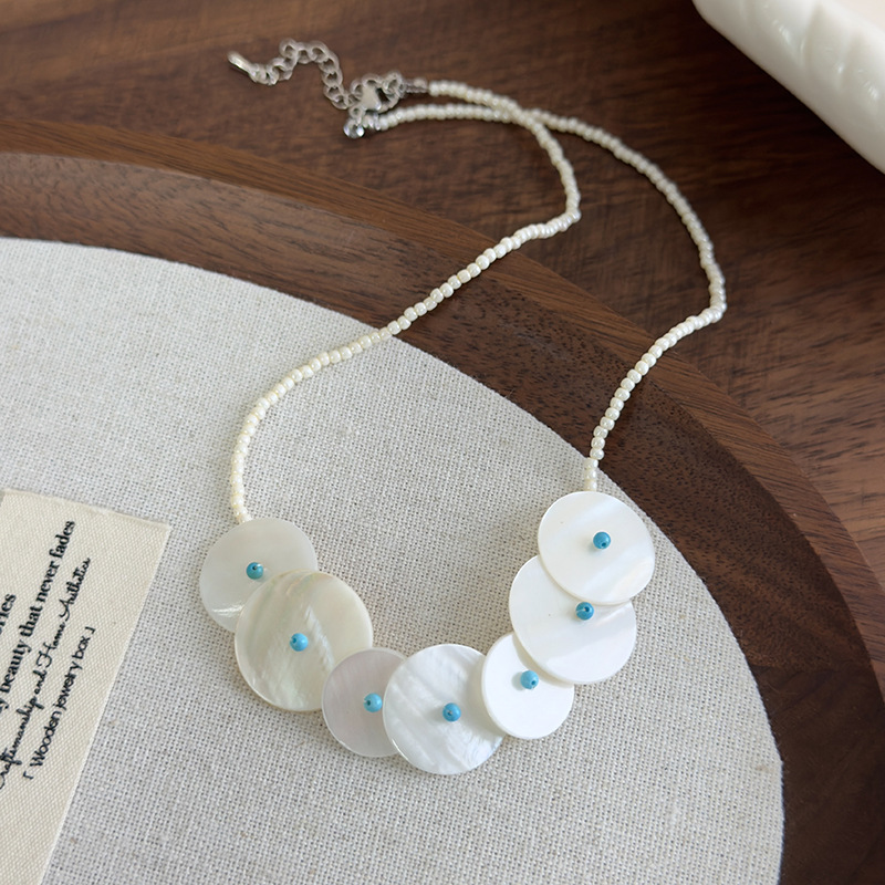 Намисто з круглими ракушками та дисковою підвіскою