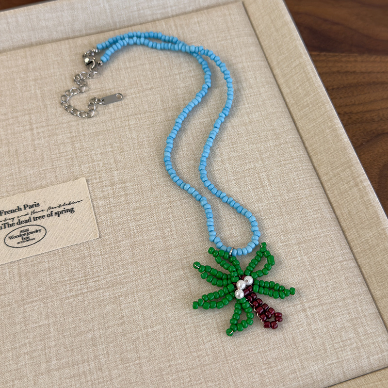 Блакитне намисто з пальмою та намистинами