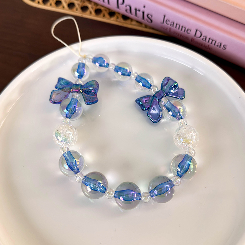 سلسلة هاتف مطرزة بشرائط