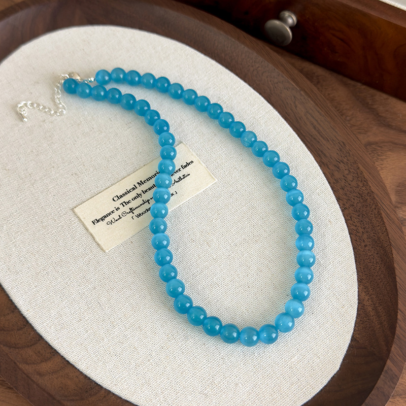 Багатошарове намисто з блакитною котячим оком квітки